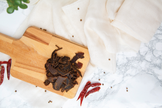 Biltong on a wooden board