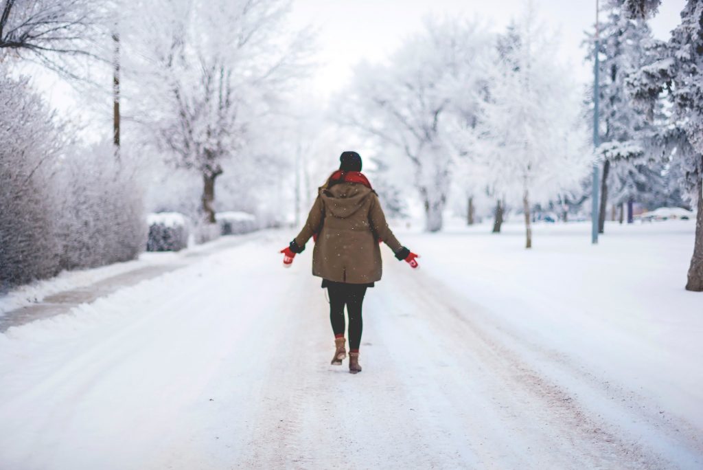 Person walking on a snow covered street