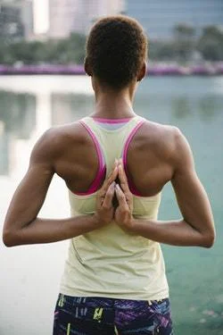 Person with Prayer/Anjali Mudra behind the back