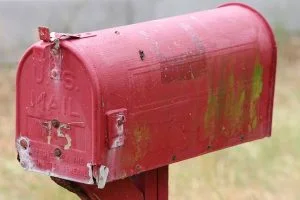 an old red US Mailbox